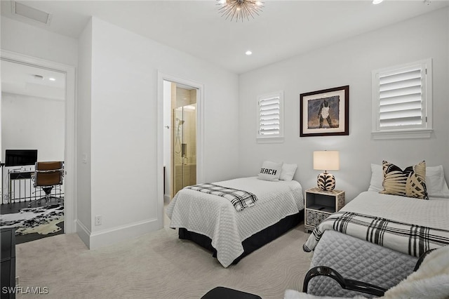 carpeted bedroom with ensuite bathroom