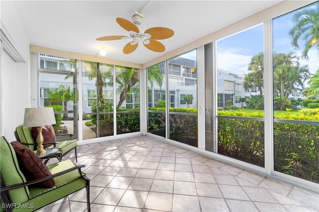 sunroom featuring ceiling fan