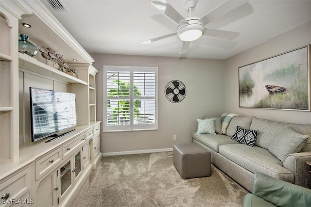 living room featuring visible vents, baseboards, light colored carpet, and ceiling fan