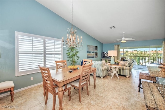 dining room with visible vents, ceiling fan with notable chandelier, baseboards, light tile patterned floors, and lofted ceiling