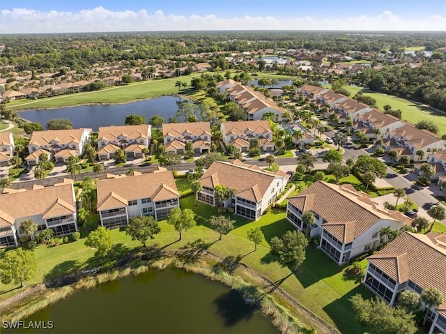 drone / aerial view with a residential view and a water view