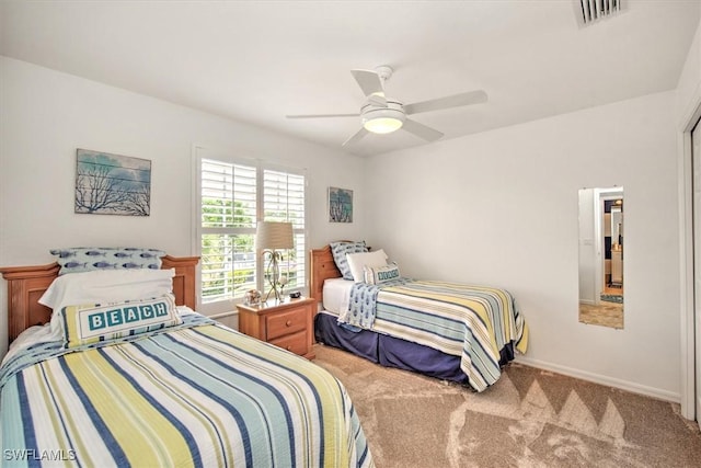 bedroom with a ceiling fan, carpet flooring, baseboards, and visible vents