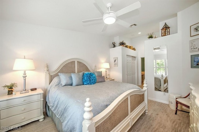 bedroom featuring a closet, visible vents, and ceiling fan