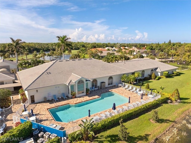 community pool featuring a patio area