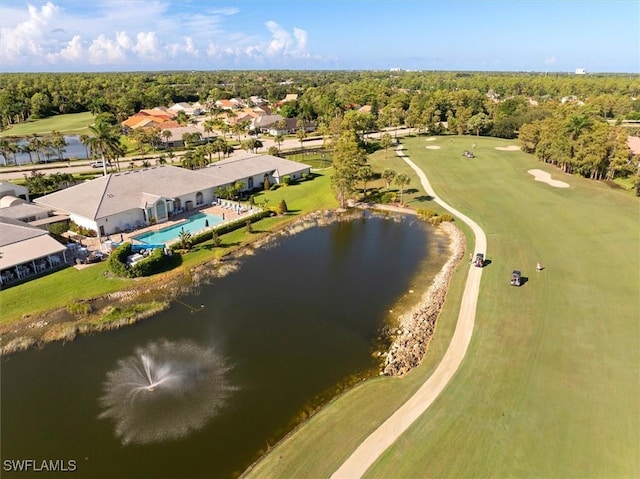 aerial view with a water view, a wooded view, and golf course view