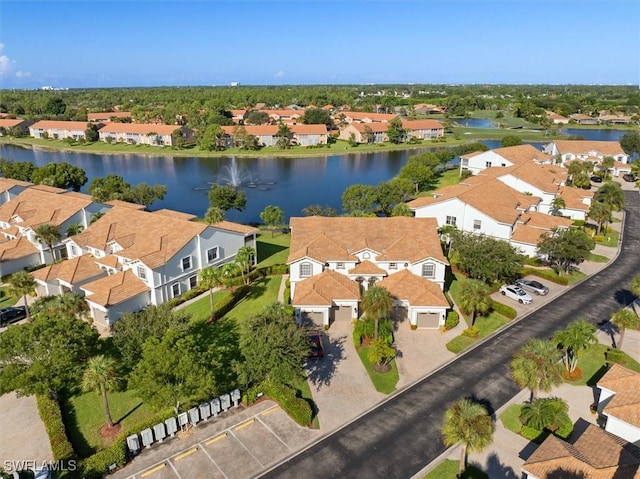 bird's eye view with a residential view and a water view