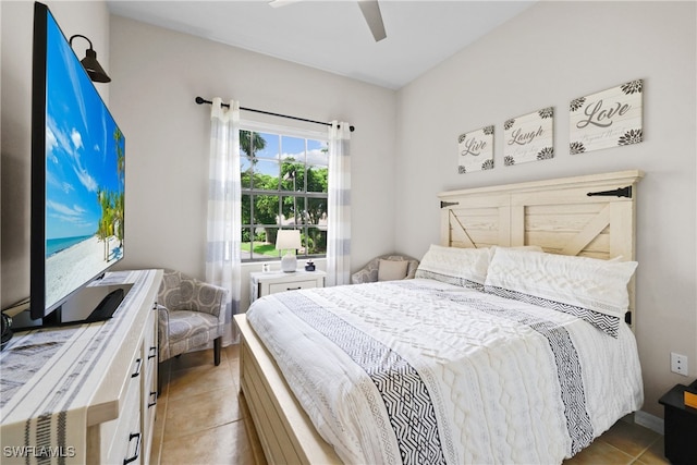 tiled bedroom with ceiling fan