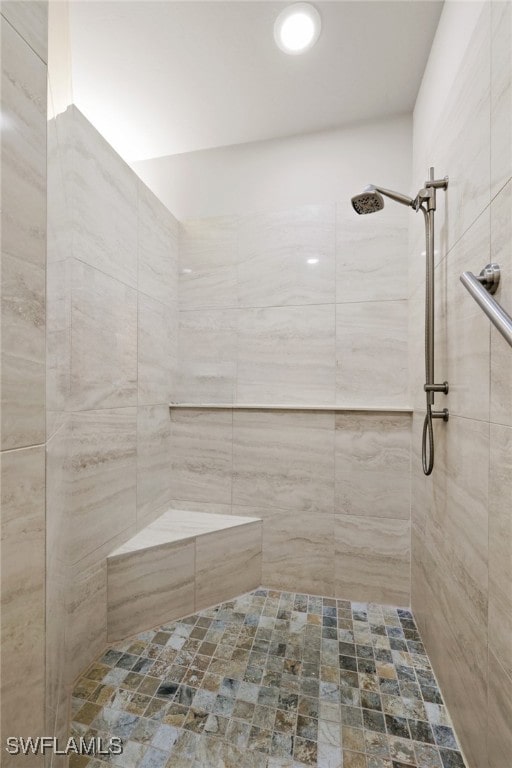 bathroom with a tile shower