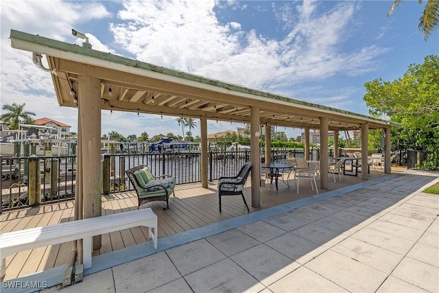 exterior space featuring a deck with water view