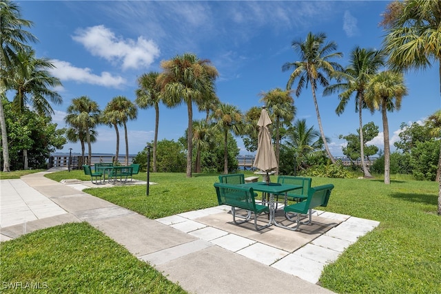 view of community featuring a patio area and a yard