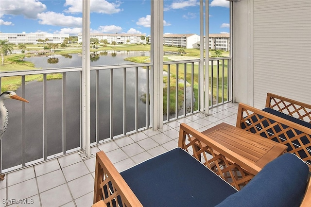 balcony featuring a water view