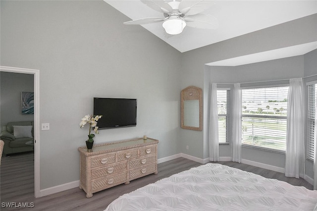 bedroom with ceiling fan, hardwood / wood-style flooring, and lofted ceiling