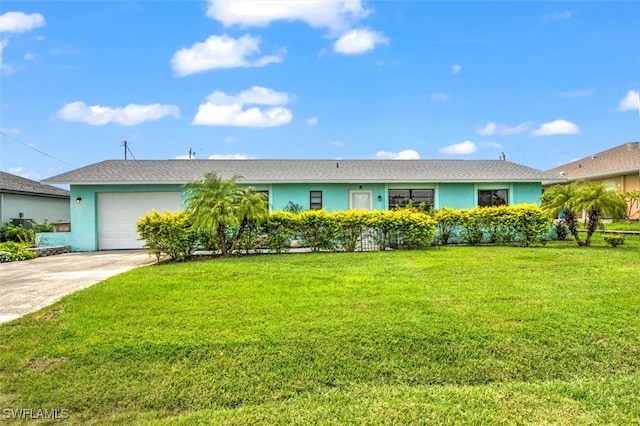 single story home with a garage and a front lawn