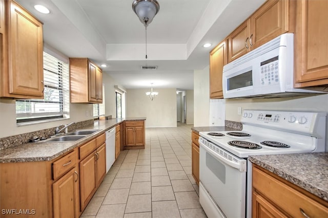 kitchen with pendant lighting, sink, a notable chandelier, white appliances, and light tile patterned floors