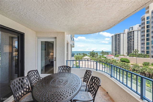 balcony featuring a water view