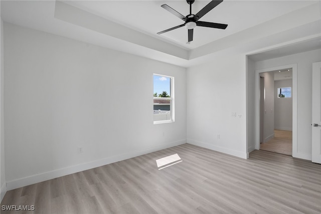 empty room featuring ceiling fan and light hardwood / wood-style floors