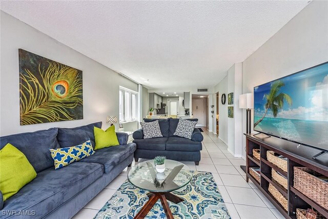 tiled living room with a textured ceiling