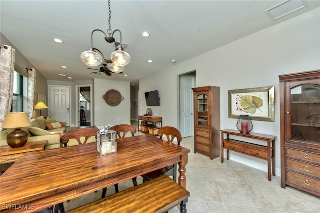 tiled dining area with a notable chandelier