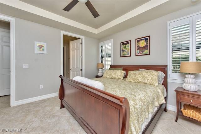 bedroom featuring ceiling fan and light tile patterned flooring