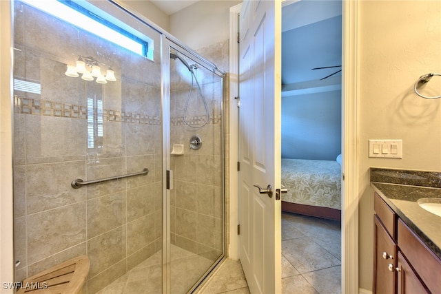 bathroom featuring vanity, tile patterned floors, and an enclosed shower