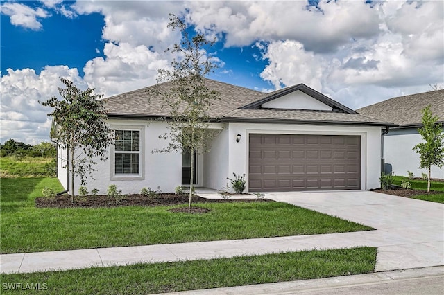 single story home featuring a front yard and a garage