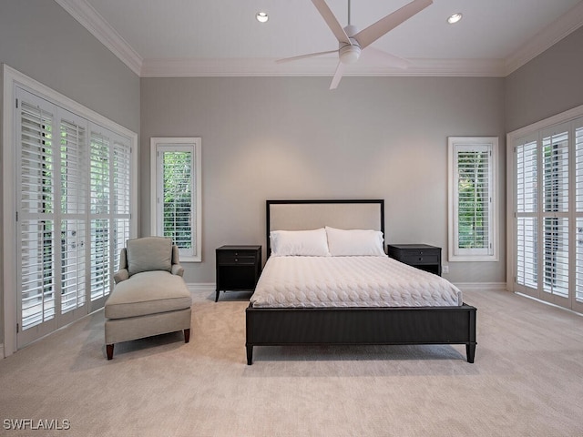 carpeted bedroom with multiple windows, access to outside, and ceiling fan