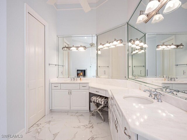 bathroom with vanity and ornamental molding