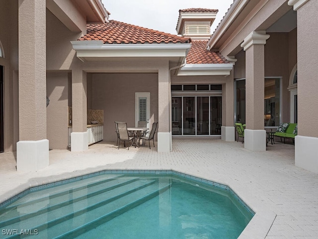 view of pool with a patio area