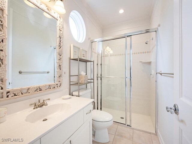 bathroom with vanity, toilet, crown molding, and a shower with shower door