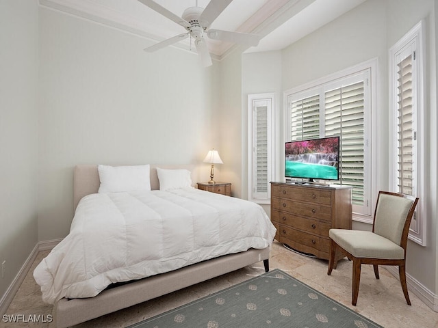 bedroom with ceiling fan and ornamental molding