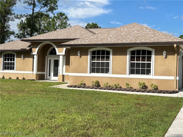 ranch-style home with a front yard