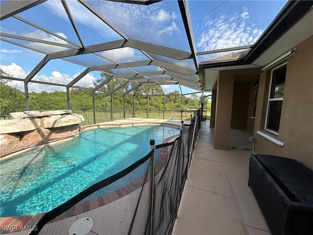 view of pool featuring a patio and a lanai