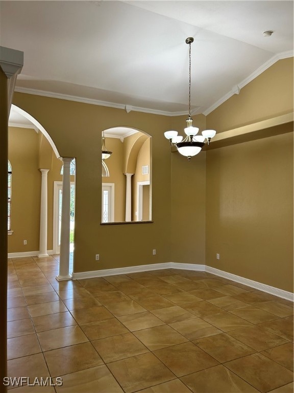 spare room with ornate columns, vaulted ceiling, crown molding, a chandelier, and tile patterned flooring