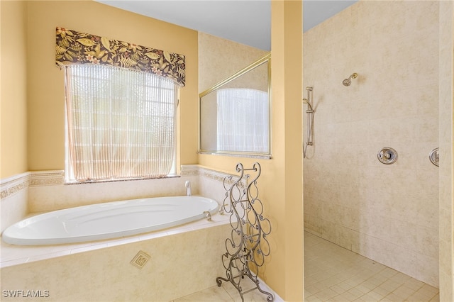 bathroom with tile patterned flooring and plus walk in shower