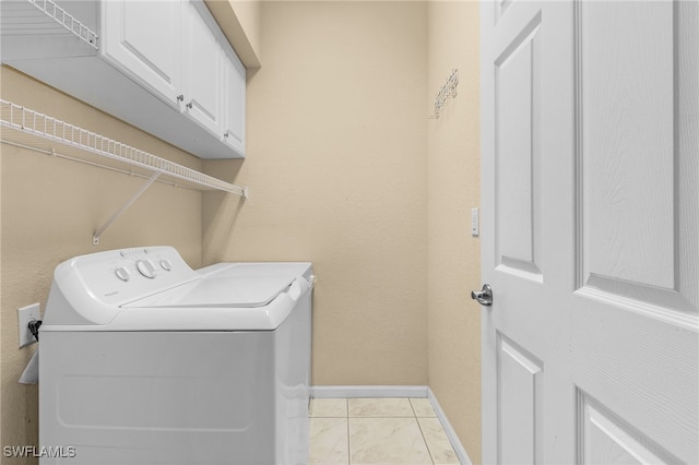 laundry area with washer and dryer and cabinets