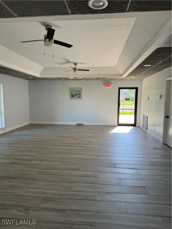 empty room featuring ceiling fan and wood-type flooring