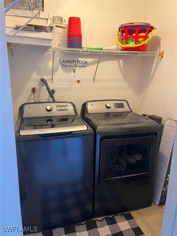 laundry area featuring independent washer and dryer