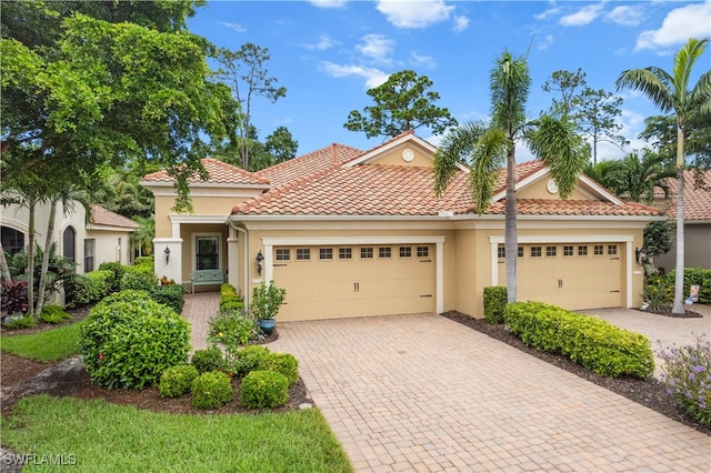 mediterranean / spanish-style house featuring a garage