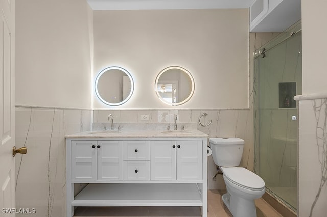 bathroom with walk in shower, vanity, and toilet