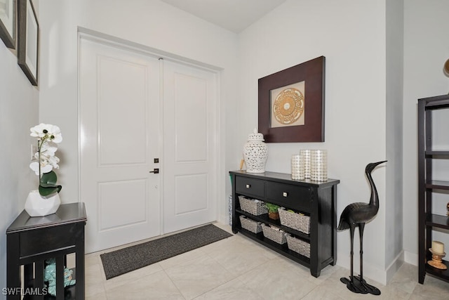 entrance foyer with light tile patterned floors