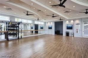 exercise area featuring ceiling fan and hardwood / wood-style floors