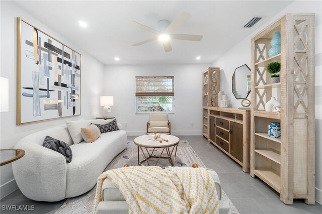 tiled living room featuring ceiling fan