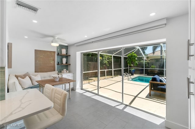 interior space with ceiling fan and plenty of natural light