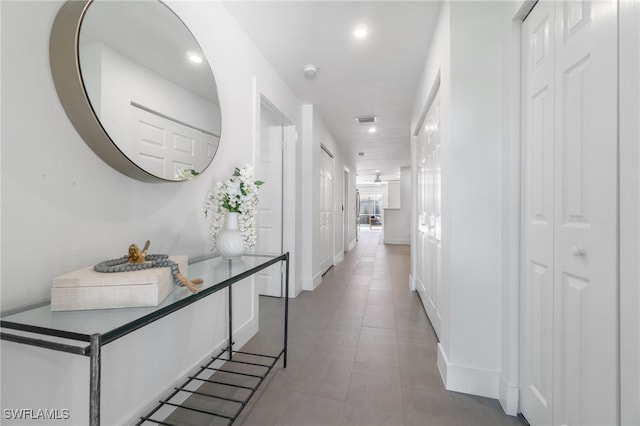 hallway featuring light tile patterned floors