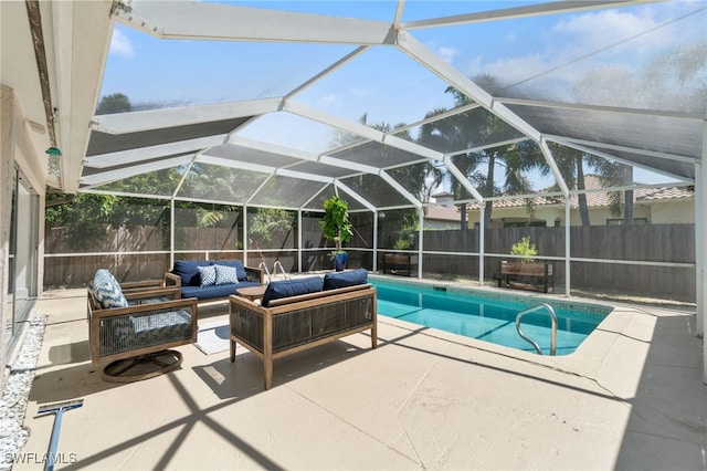 view of pool with a lanai, an outdoor living space, and a patio area