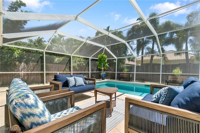 view of swimming pool with outdoor lounge area and a lanai