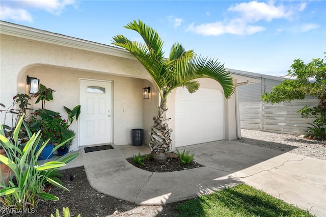 view of exterior entry featuring a garage