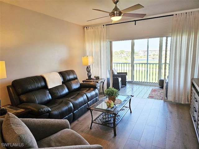 living room featuring wood finished floors and a ceiling fan