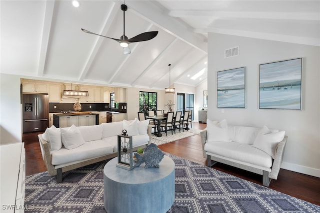 living room featuring beam ceiling, dark wood-type flooring, ceiling fan, and high vaulted ceiling