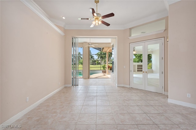 unfurnished room with crown molding, light tile patterned floors, ceiling fan, and french doors